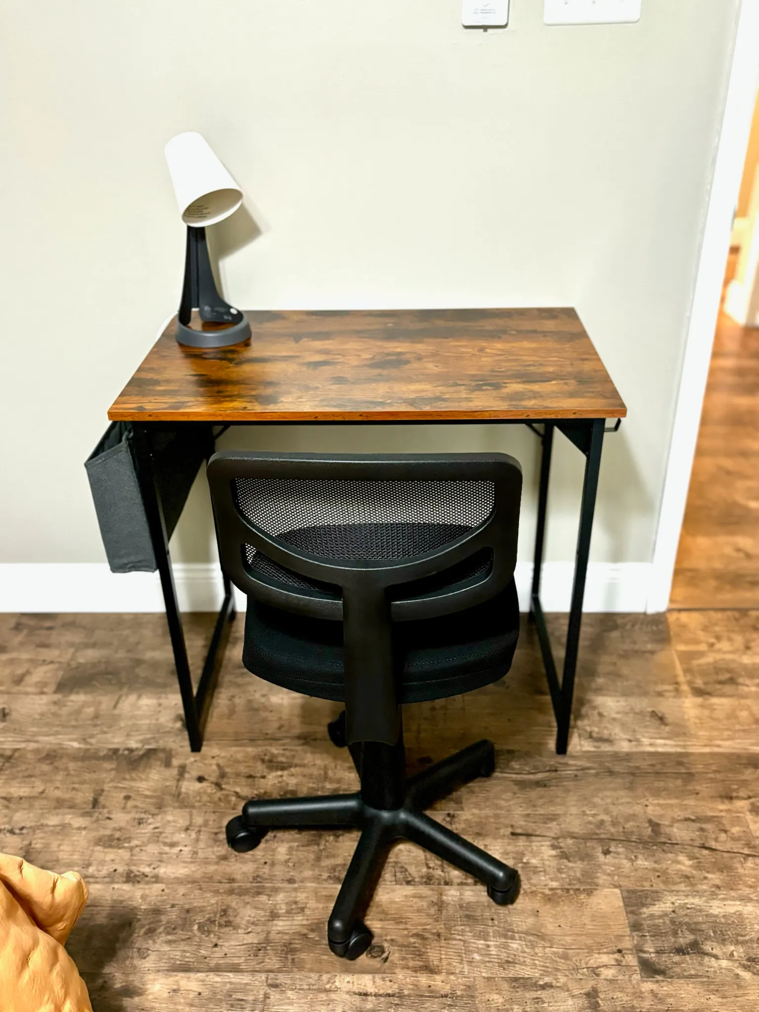 Dedicated workspace with desk, chair and reading lamp